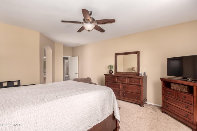1453 E Elgin Pl, Chandler, AZ 85225 - bedroom with light carpet, arched walkways, ceiling fan, and baseboards