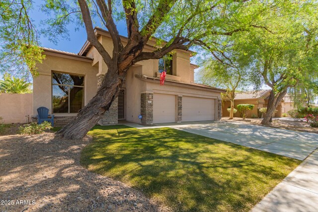 1453 E Elgin Pl, Chandler, AZ 85225 - view of front facade with stucco siding, a garage, driveway, stone siding, and a front yard