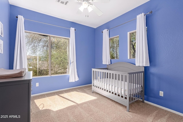 1453 E Elgin Pl, Chandler, AZ 85225 - carpeted bedroom featuring multiple windows, a nursery area, baseboards, and ceiling fan