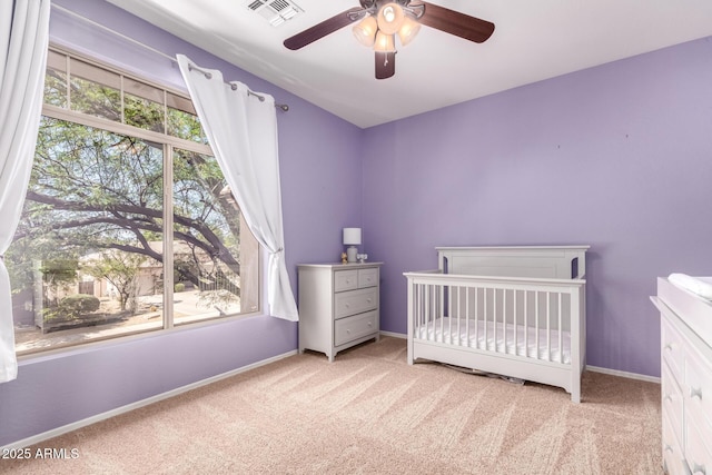 1453 E Elgin Pl, Chandler, AZ 85225 - carpeted bedroom with baseboards, a nursery area, and a ceiling fan