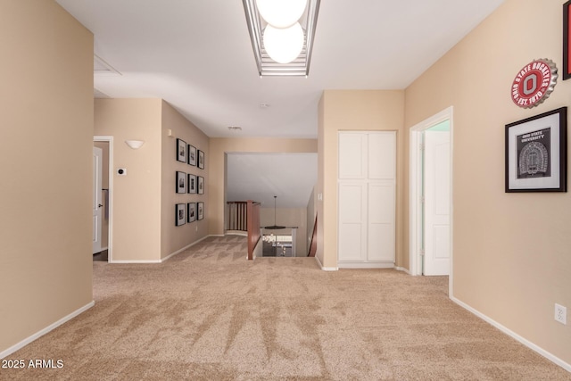 1453 E Elgin Pl, Chandler, AZ 85225 - unfurnished living room featuring carpet floors and baseboards