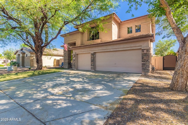 1453 E Elgin Pl, Chandler, AZ 85225 - view of front of home with a garage, a gate, stucco siding, stone siding, and concrete driveway