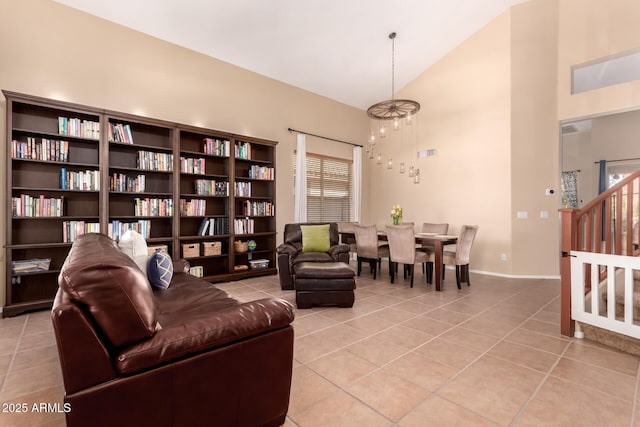 1453 E Elgin Pl, Chandler, AZ 85225 - living area with a chandelier, light tile patterned floors, high vaulted ceiling, baseboards, and stairs