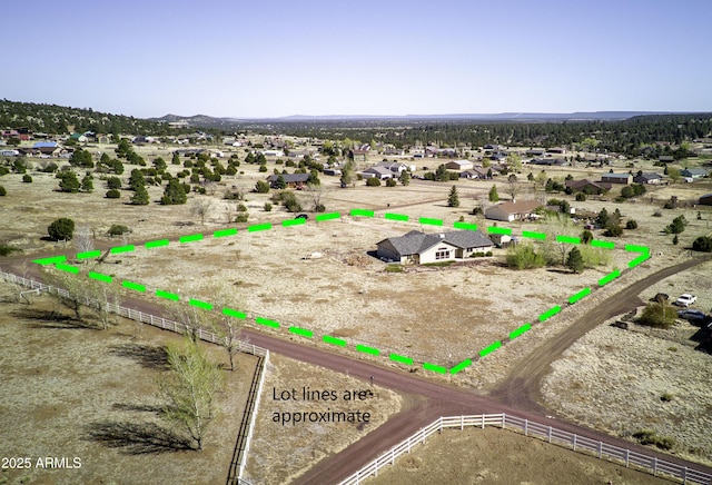 birds eye view of property with a mountain view