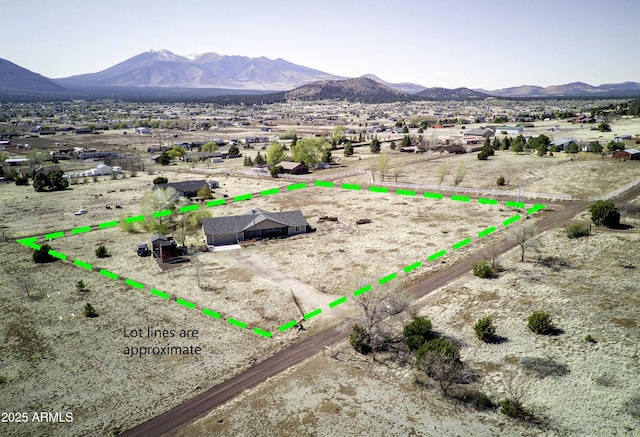 drone / aerial view featuring a mountain view