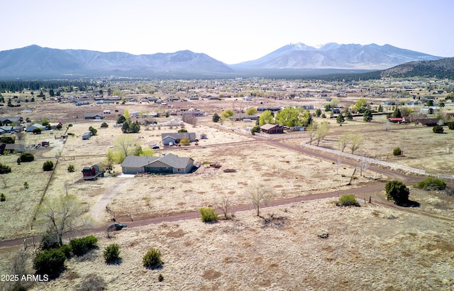 drone / aerial view with a mountain view and a rural view