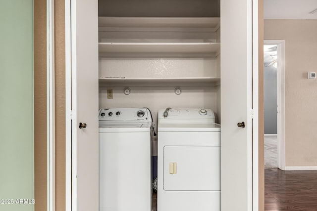 laundry area with laundry area, wood finished floors, visible vents, baseboards, and independent washer and dryer