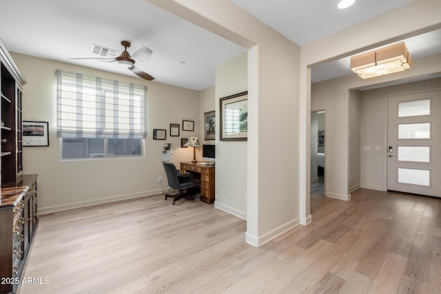 office space with ceiling fan and light hardwood / wood-style floors