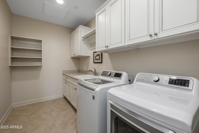 clothes washing area with cabinets, separate washer and dryer, sink, and light tile patterned floors