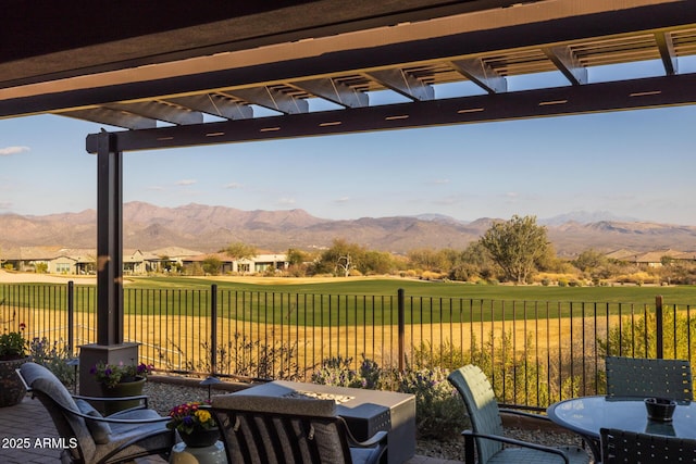 view of patio / terrace with a mountain view and a pergola