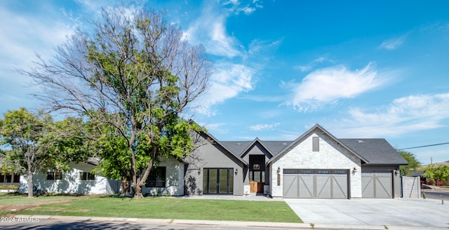 view of front facade with a front lawn and a garage