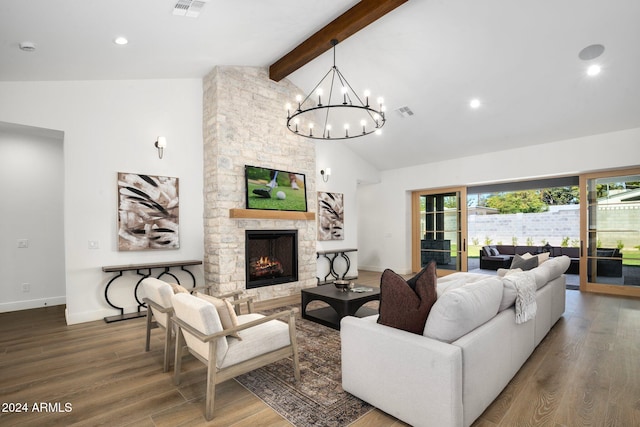 living room with beamed ceiling, a chandelier, a fireplace, and hardwood / wood-style flooring