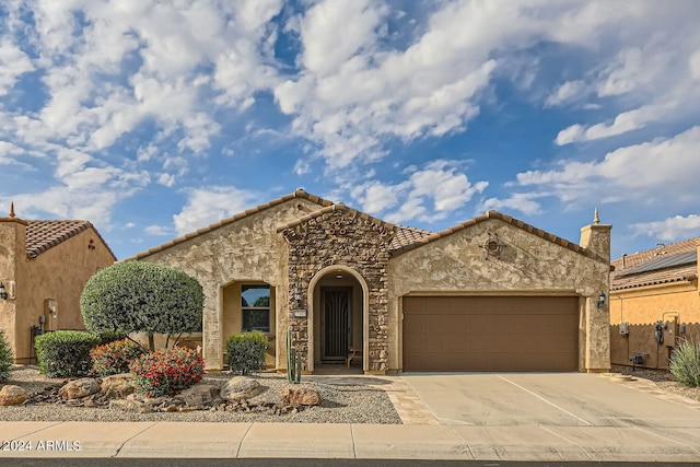 view of front of property featuring a garage