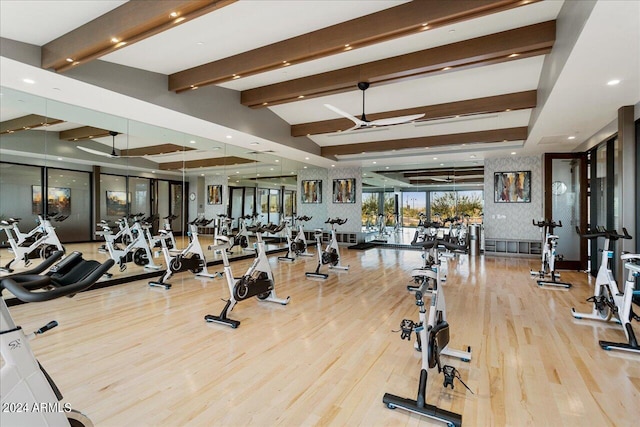 exercise room with hardwood / wood-style flooring and ceiling fan