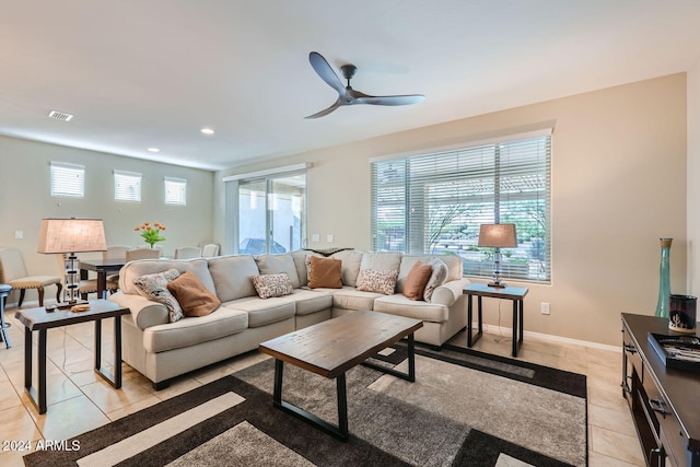 living room with light tile patterned floors and ceiling fan