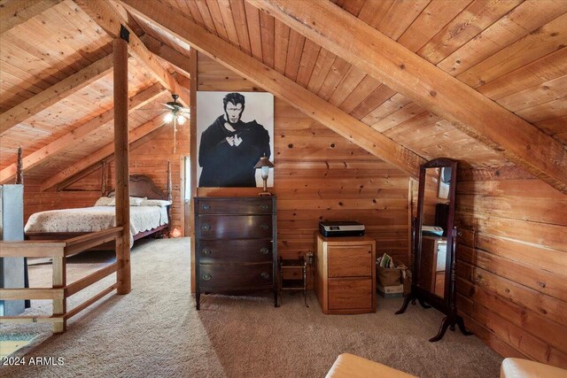 unfurnished bedroom with carpet flooring, wooden walls, wooden ceiling, and vaulted ceiling with beams