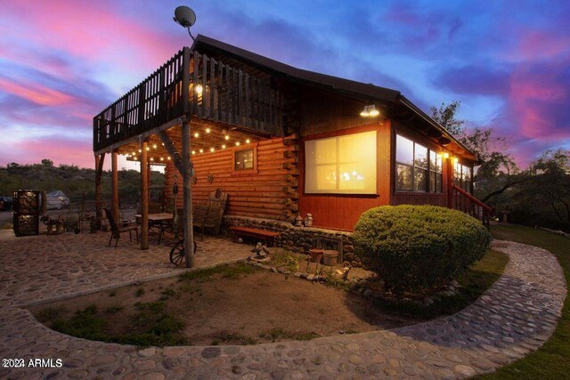 view of outdoor structure at dusk