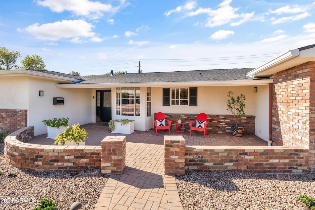 rear view of house with a patio