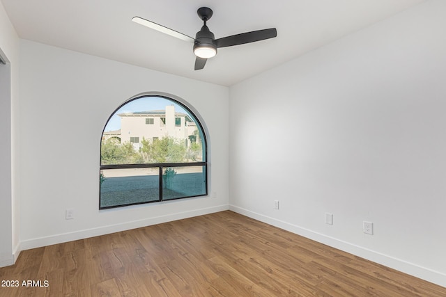 unfurnished room with ceiling fan and light hardwood / wood-style floors