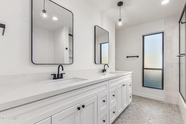 bathroom with bath / shower combo with glass door and vanity