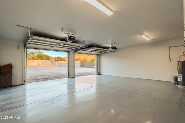 garage featuring water heater and a garage door opener