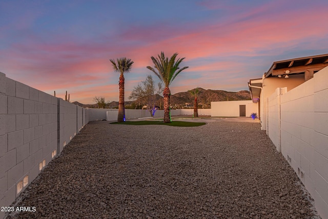 yard at dusk with a mountain view