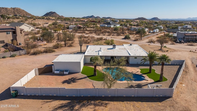 birds eye view of property with a mountain view