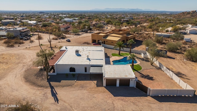 birds eye view of property with a mountain view