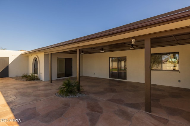 exterior space featuring ceiling fan