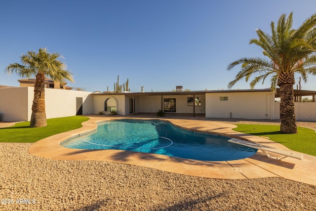 view of swimming pool with a patio