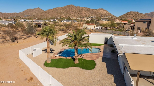 view of pool with a mountain view and a patio area