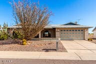 view of front of property with a garage and driveway