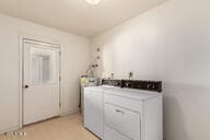 clothes washing area featuring laundry area and independent washer and dryer