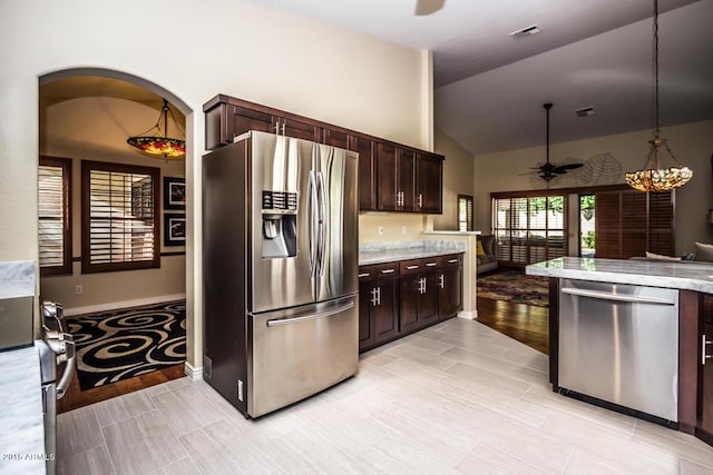 16446 N 59th St, Scottsdale, AZ 85254 - kitchen with a ceiling fan, decorative light fixtures, stainless steel appliances, lofted ceiling, and dark brown cabinets