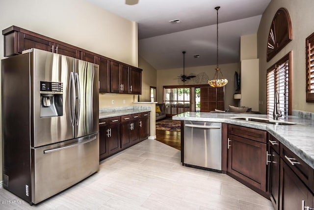 16446 N 59th St, Scottsdale, AZ 85254 - kitchen with ceiling fan, open floor plan, vaulted ceiling, appliances with stainless steel finishes, and a sink