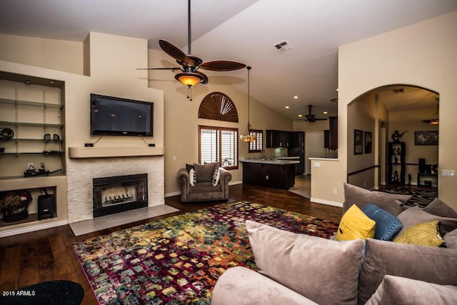16446 N 59th St, Scottsdale, AZ 85254 - living area with visible vents, a fireplace with flush hearth, dark wood-type flooring, a ceiling fan, and lofted ceiling