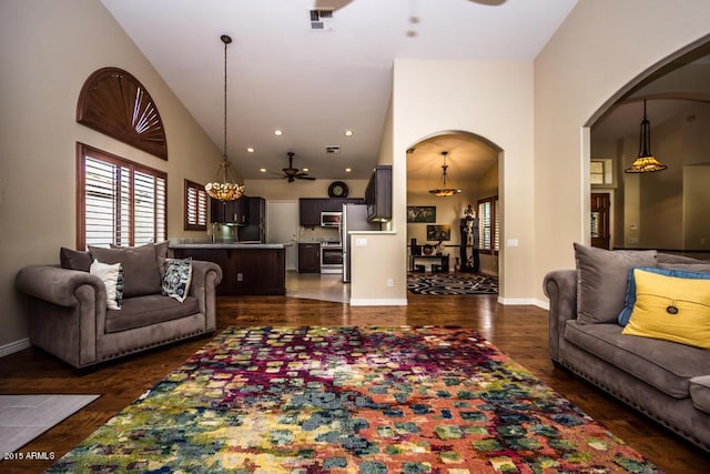 16446 N 59th St, Scottsdale, AZ 85254 - living room with visible vents, dark wood-style floors, arched walkways, baseboards, and ceiling fan