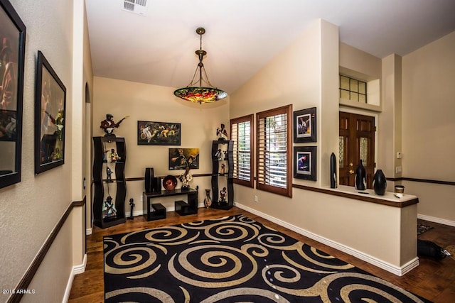 16446 N 59th St, Scottsdale, AZ 85254 - hallway featuring dark wood-type flooring, baseboards, visible vents, and lofted ceiling
