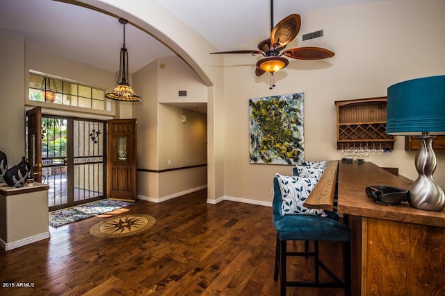 16446 N 59th St, Scottsdale, AZ 85254 - interior space featuring visible vents, ceiling fan, hardwood / wood-style floors, a towering ceiling, and arched walkways