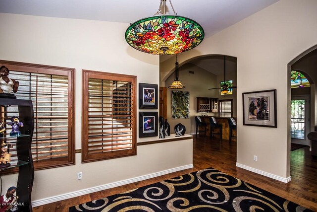 16446 N 59th St, Scottsdale, AZ 85254 - corridor with vaulted ceiling, wood finished floors, arched walkways, and baseboards