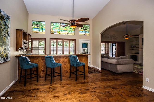 16446 N 59th St, Scottsdale, AZ 85254 - kitchen featuring baseboards, wood finished floors, high vaulted ceiling, and ceiling fan