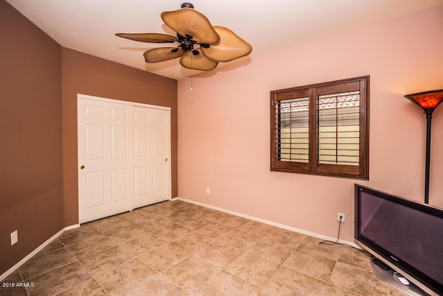 16446 N 59th St, Scottsdale, AZ 85254 - unfurnished bedroom with a closet, baseboards, and a ceiling fan