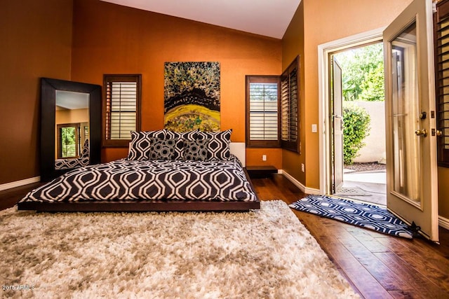 16446 N 59th St, Scottsdale, AZ 85254 - bedroom with vaulted ceiling, access to exterior, baseboards, and wood-type flooring