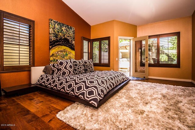 16446 N 59th St, Scottsdale, AZ 85254 - bedroom featuring lofted ceiling, multiple windows, wood finished floors, and baseboards