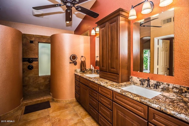 16446 N 59th St, Scottsdale, AZ 85254 - bathroom with visible vents, a ceiling fan, a walk in shower, a sink, and a textured wall