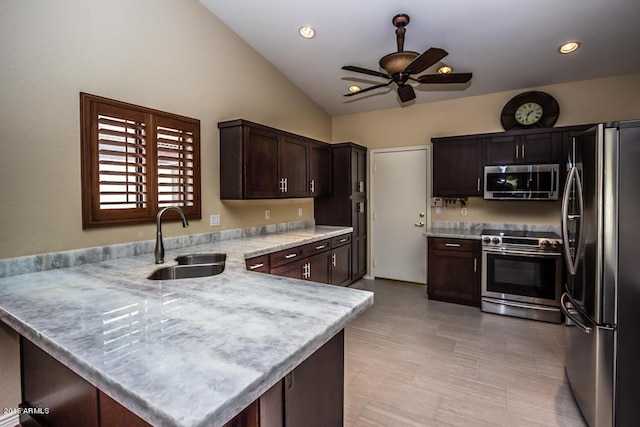 16446 N 59th St, Scottsdale, AZ 85254 - kitchen featuring a ceiling fan, a sink, stainless steel appliances, a peninsula, and dark brown cabinets