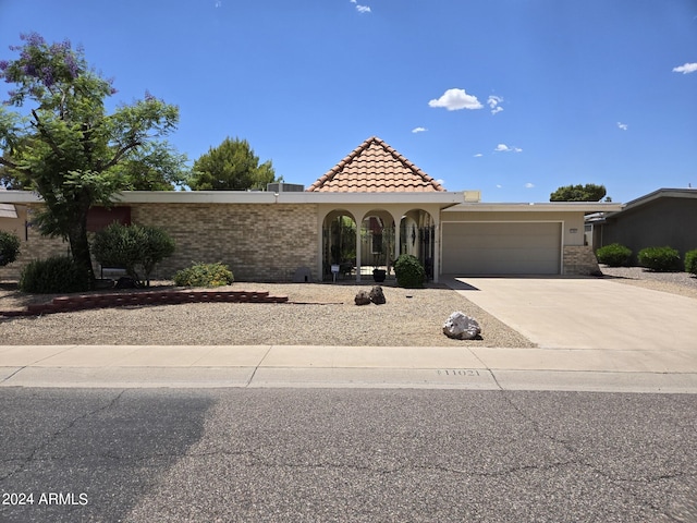 view of front of property with a garage