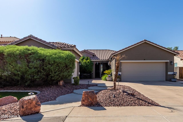 13629 W San Miguel Ave, Litchfield Park, AZ 85340 - ranch-style home with stucco siding, concrete driveway, a garage, and a tiled roof