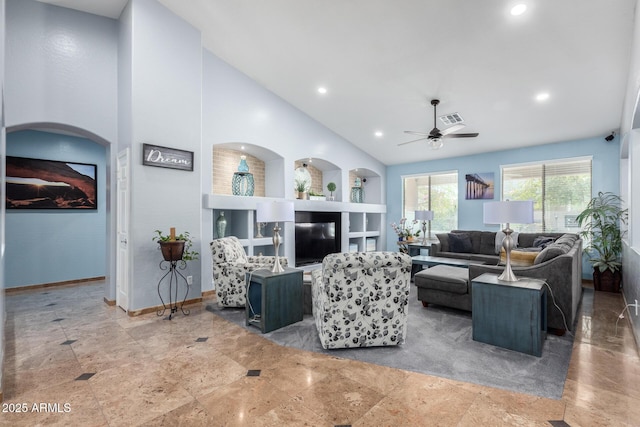 13629 W San Miguel Ave, Litchfield Park, AZ 85340 - living area featuring a ceiling fan, baseboards, built in shelves, recessed lighting, and high vaulted ceiling