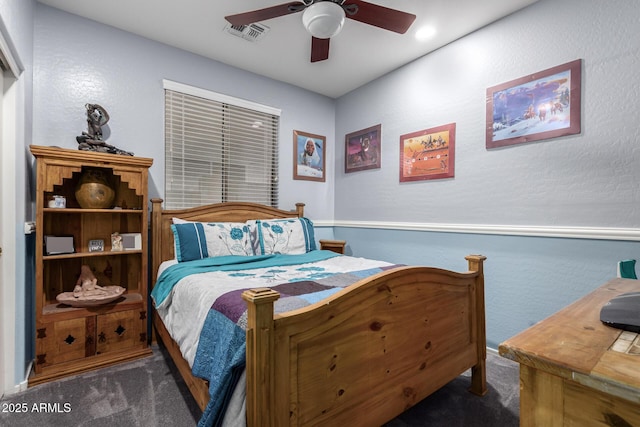 13629 W San Miguel Ave, Litchfield Park, AZ 85340 - bedroom featuring carpet floors, a ceiling fan, and a textured wall
